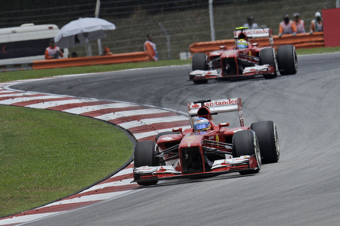 Alonso and Massa managed second and third  in last lap sprints