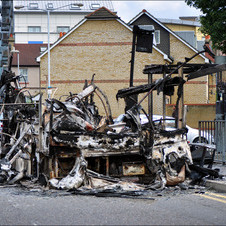 Cars being destroyed with London riots