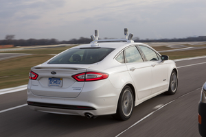 The car includes four LiDAR light-emitting sensors