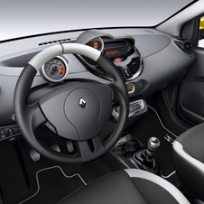 The steering wheel, seats and dashboard have yellow stitching