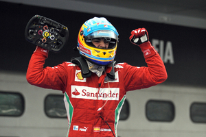 Alonso takes win in wet race in Sepang